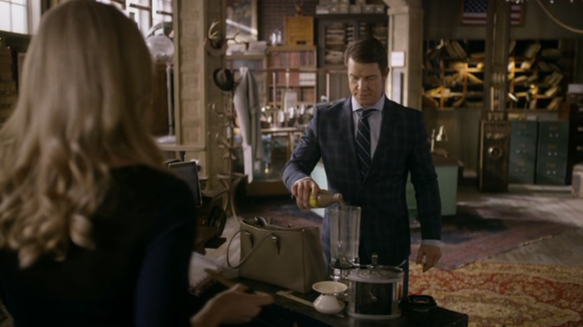 Eric Mabius as Oliver O'Toole pouring YooHoo in Signed, Sealed, Delivered: Higher Ground