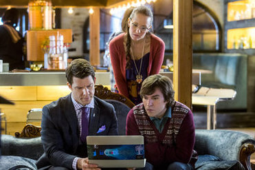 Rita, Oliver & Norman around a computer